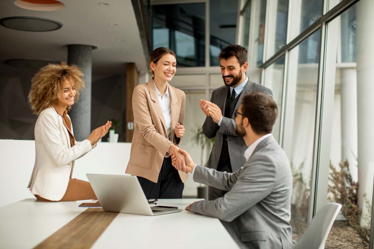 Group of workers around a conference room table