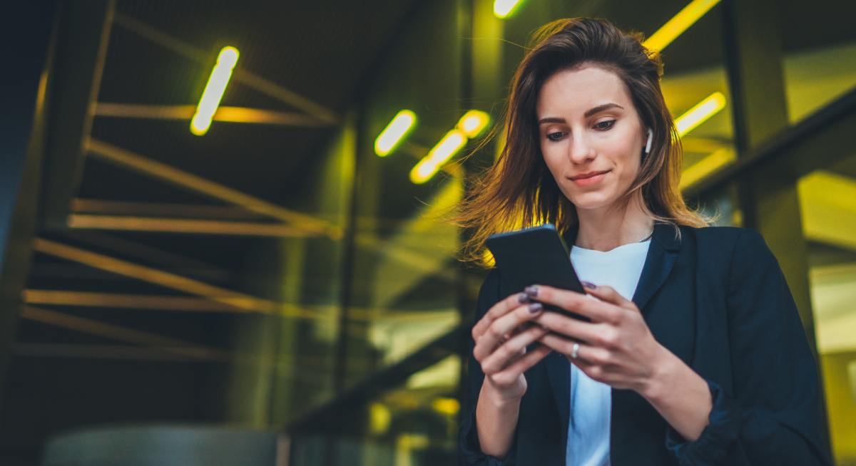 woman looking at her mobile phone